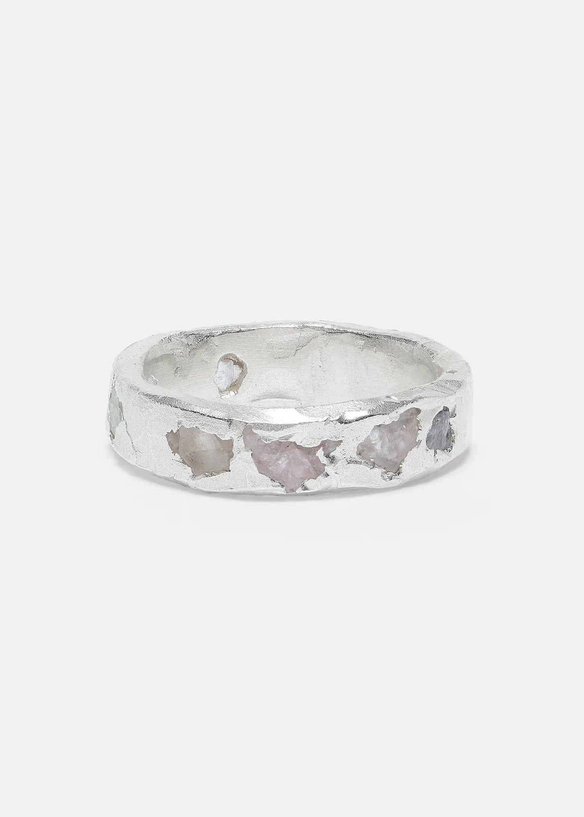 Silver ring with butterfly designs on a light gray background