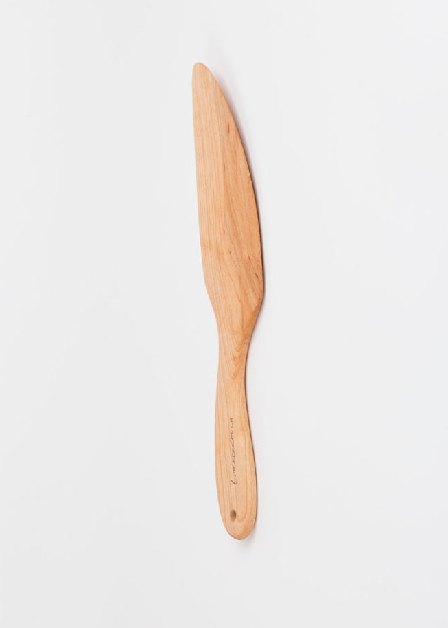 Wooden spatula on a white background