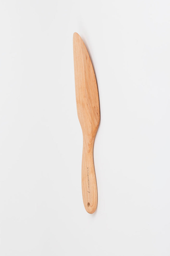 Wooden spatula on a white background