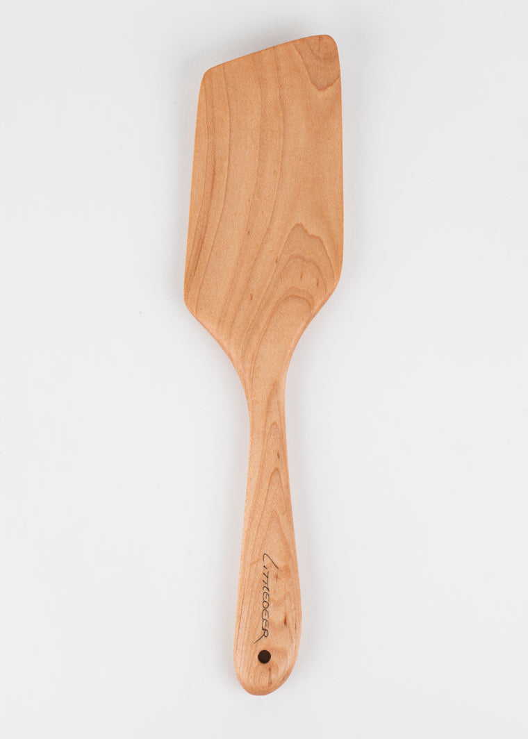 Wooden spatula on a white background