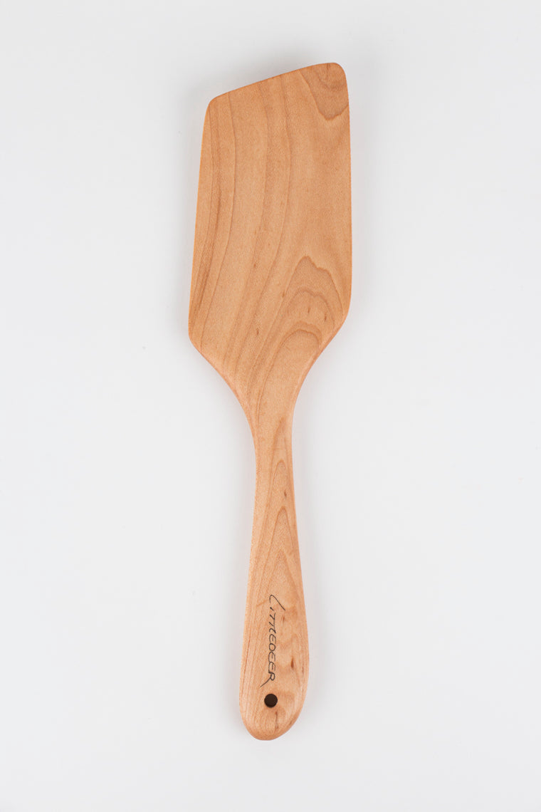 Wooden spatula on a white background