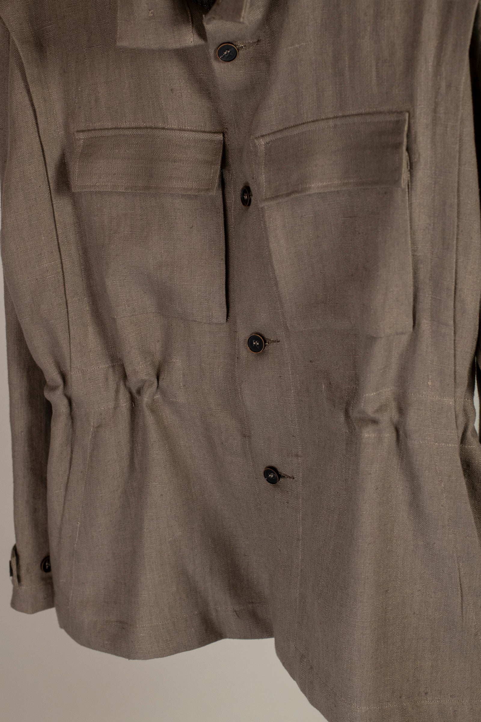 Close up view of front of Wanze men's natural linen field jacket in brown